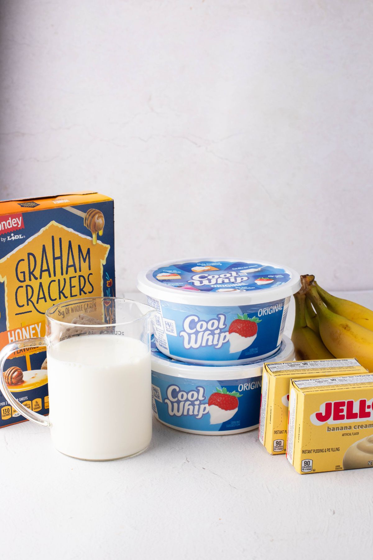 Graham crackers, whipped cream, banana, jello and milk. 