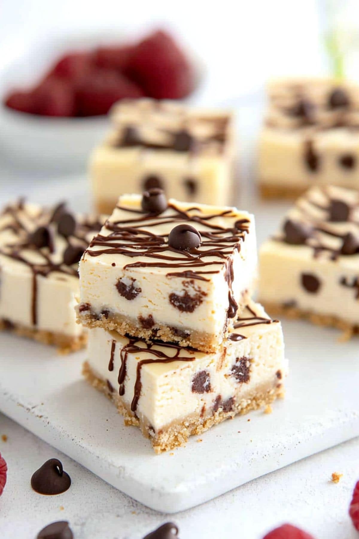 Square slices of  cheesecake bars with mini chocolate chips.