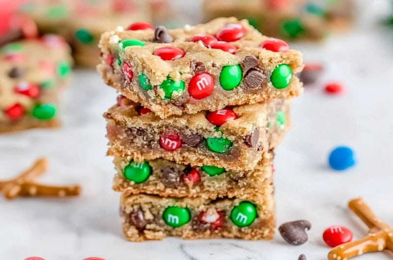 Sweet stacked Christmas cookie bars with colorful candies and chocolate chips.