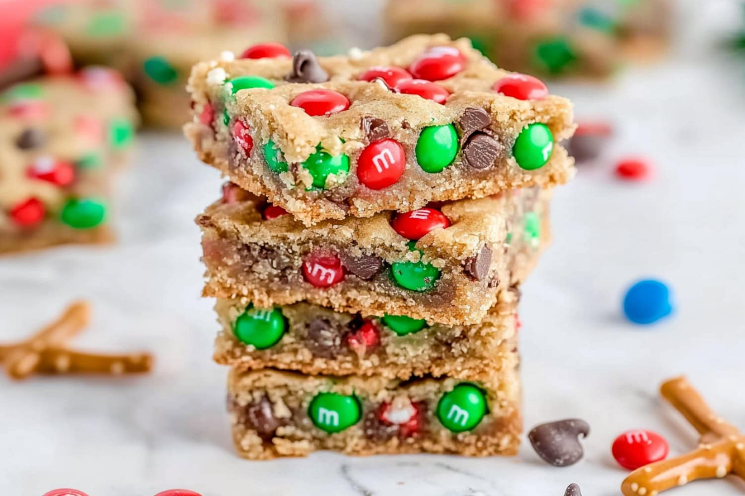 Sweet stacked Christmas cookie bars with colorful candies and chocolate chips.