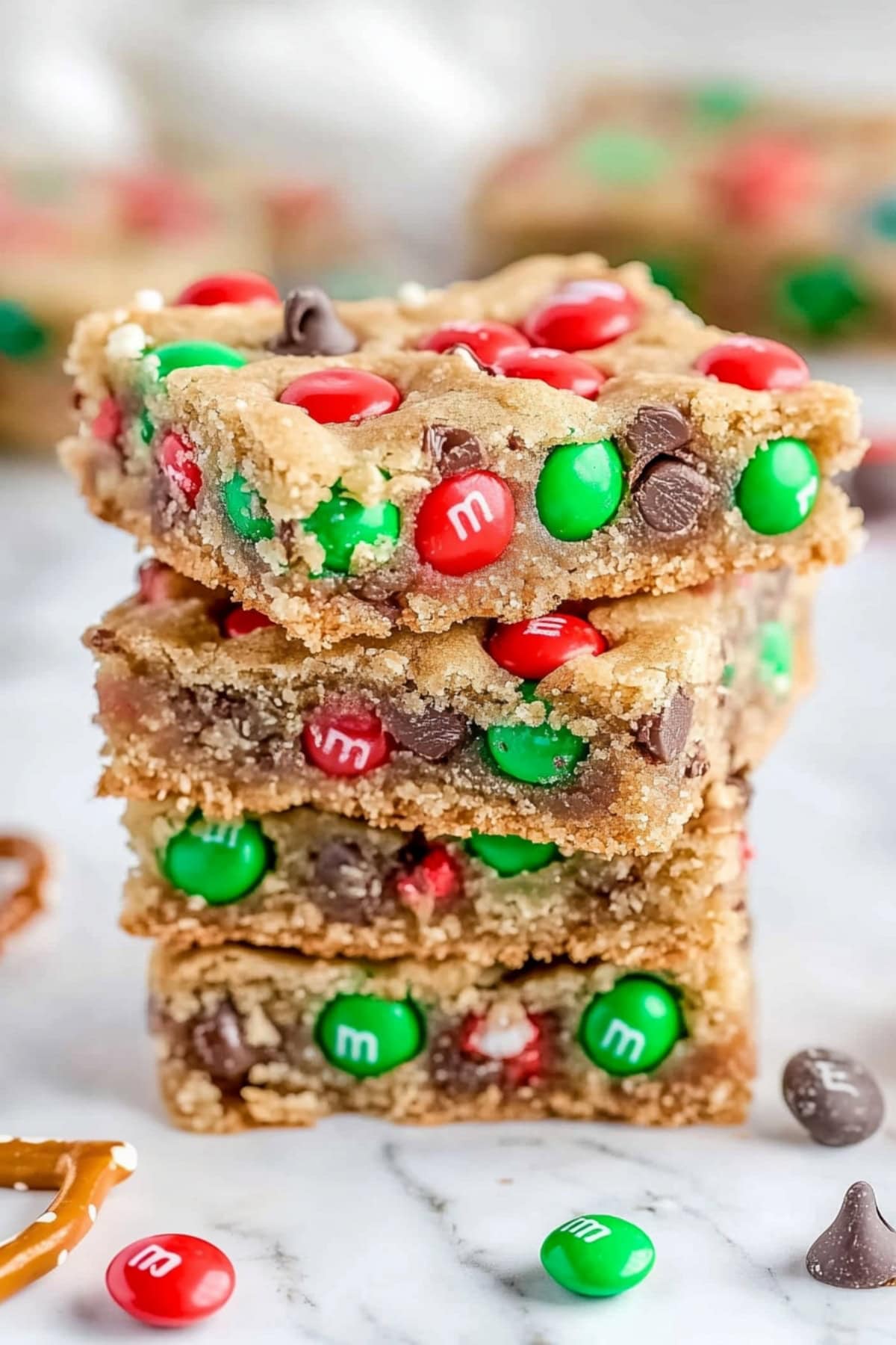 Christmas cookie bars with colorful M&M candies and chocolate chips.