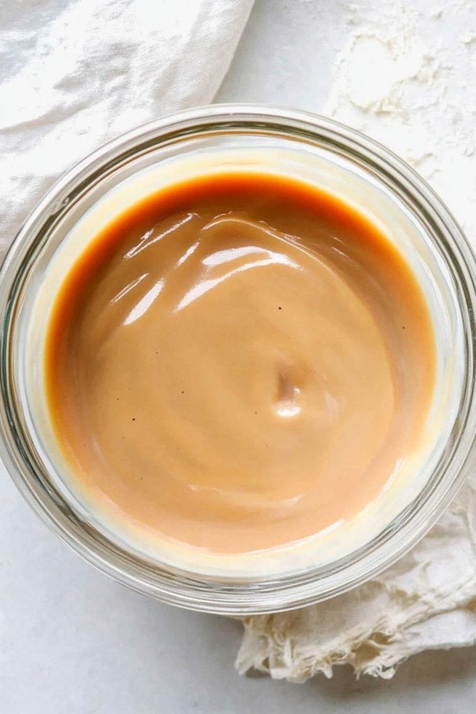 Caramel sauce in a glass bowl.