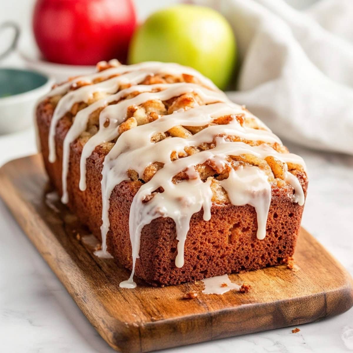 Glazed Amish Apple Fritter Bread on a Cutting Board