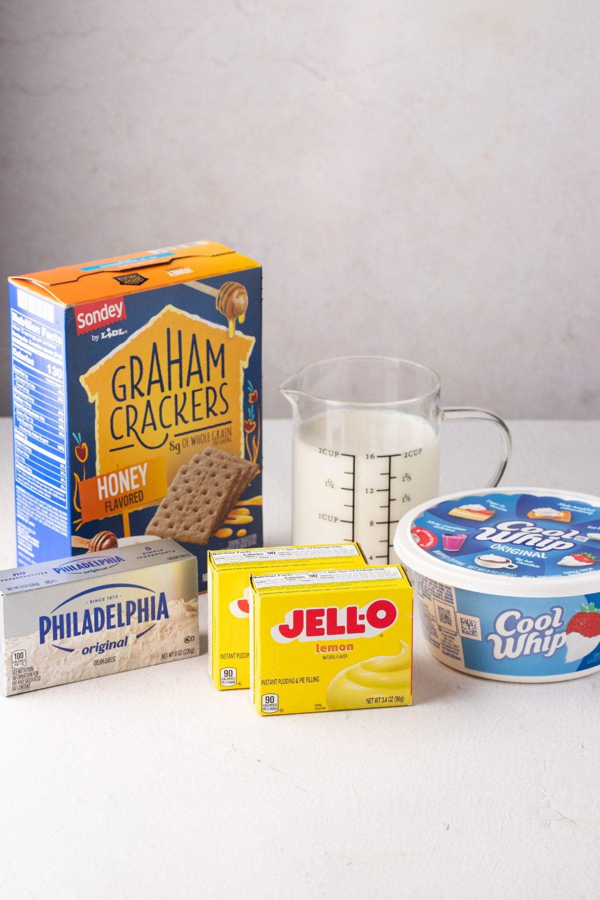Graham crackers, jello, cool whip, milk and cream cheese.