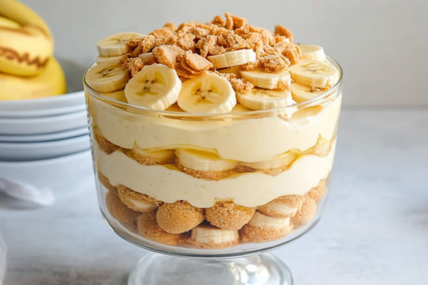 Magnolia bakery banana pudding in a large glass trifle made with layers of Nila wafers, sliced bananas and pudding.