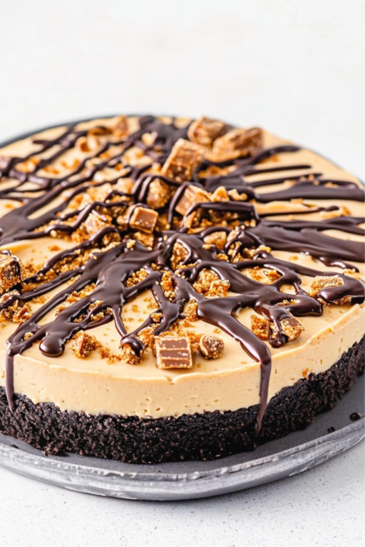 Whole no bake Butterfinger pie in a large plate.