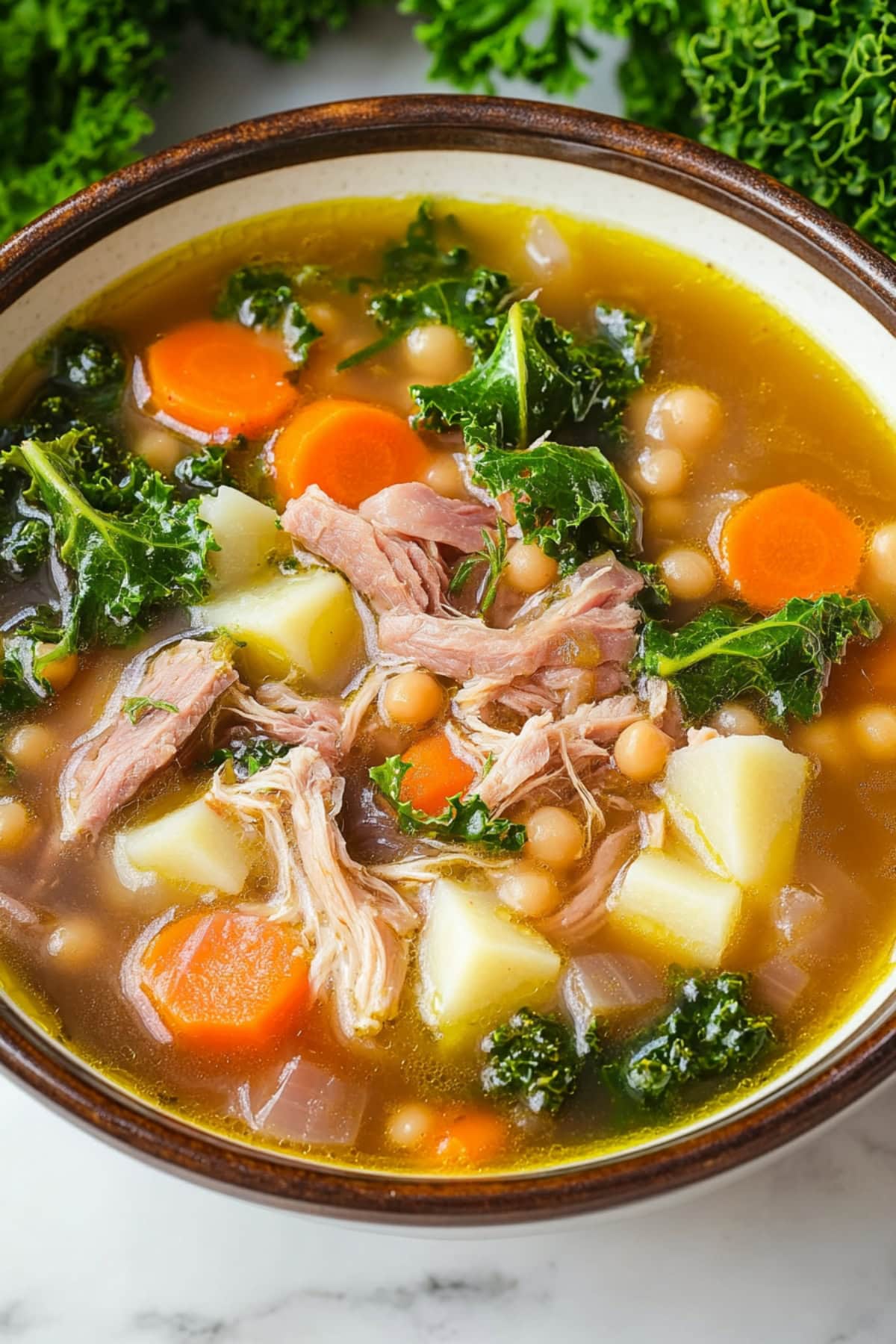 A bowl of homemade scotch broth with meat and veggies.