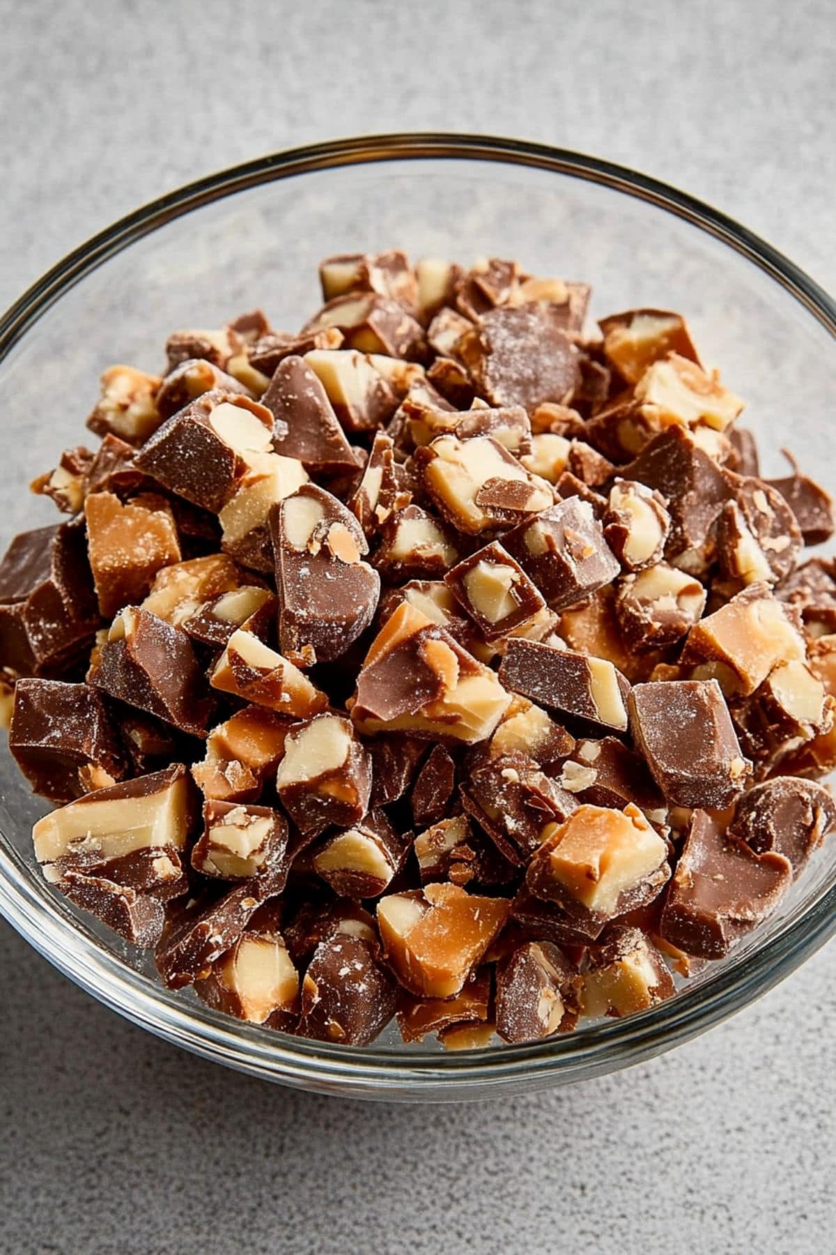 Chopped Snickers in a glass bowl.