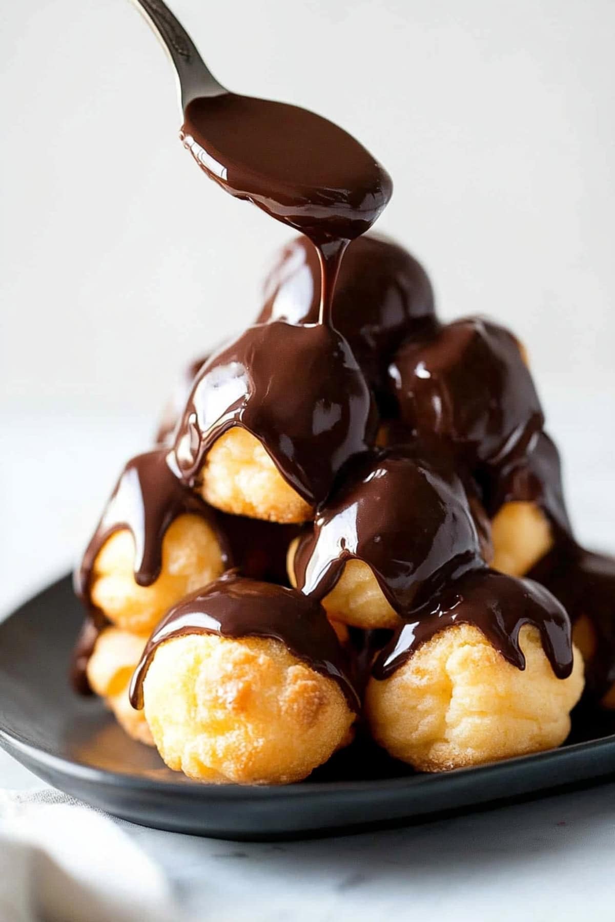 Stack of Profiteroles with Chocolate Glaze