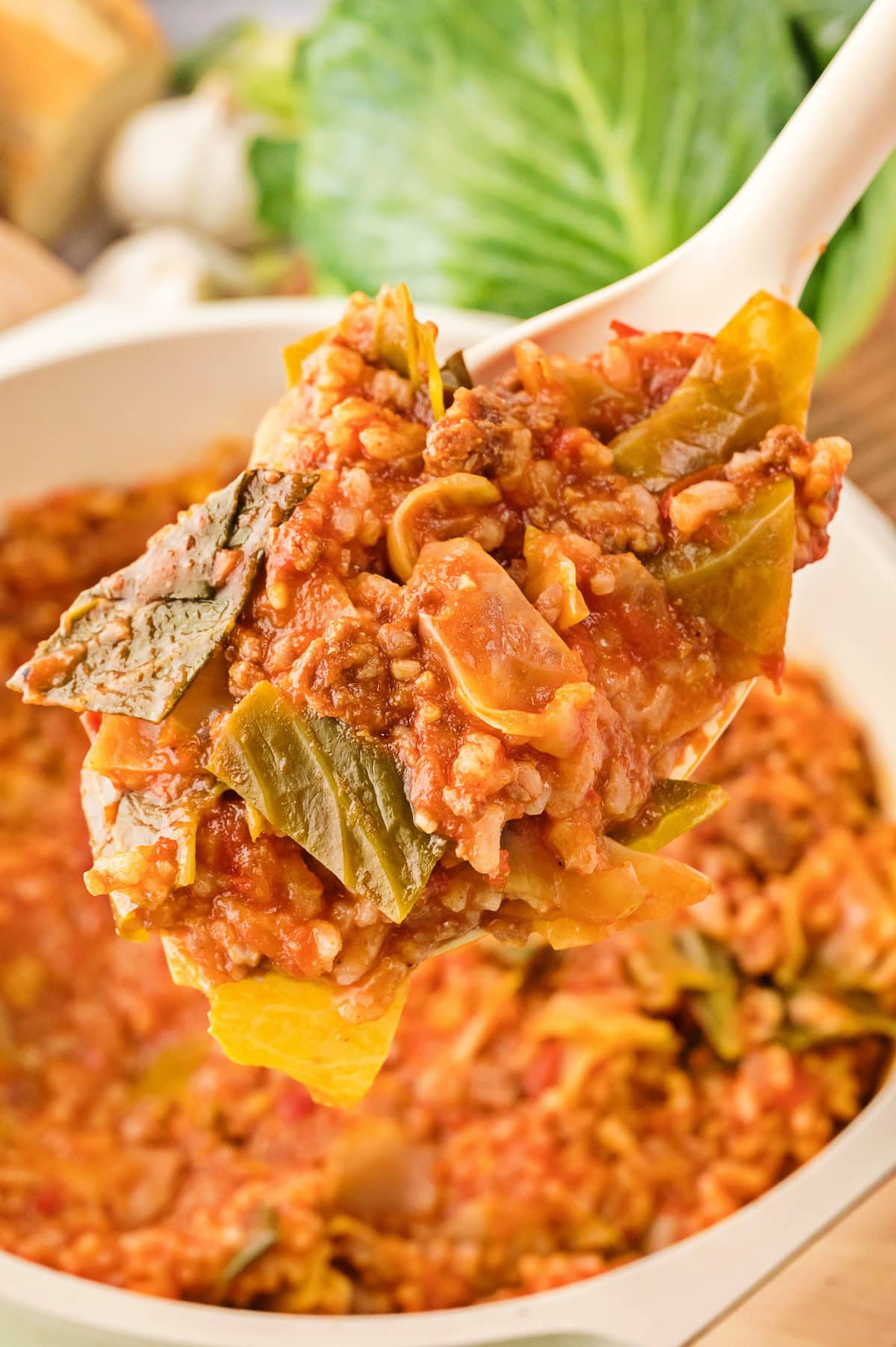 A spoonful of Unstuffed Cabbage Rolls lifted from the pot.