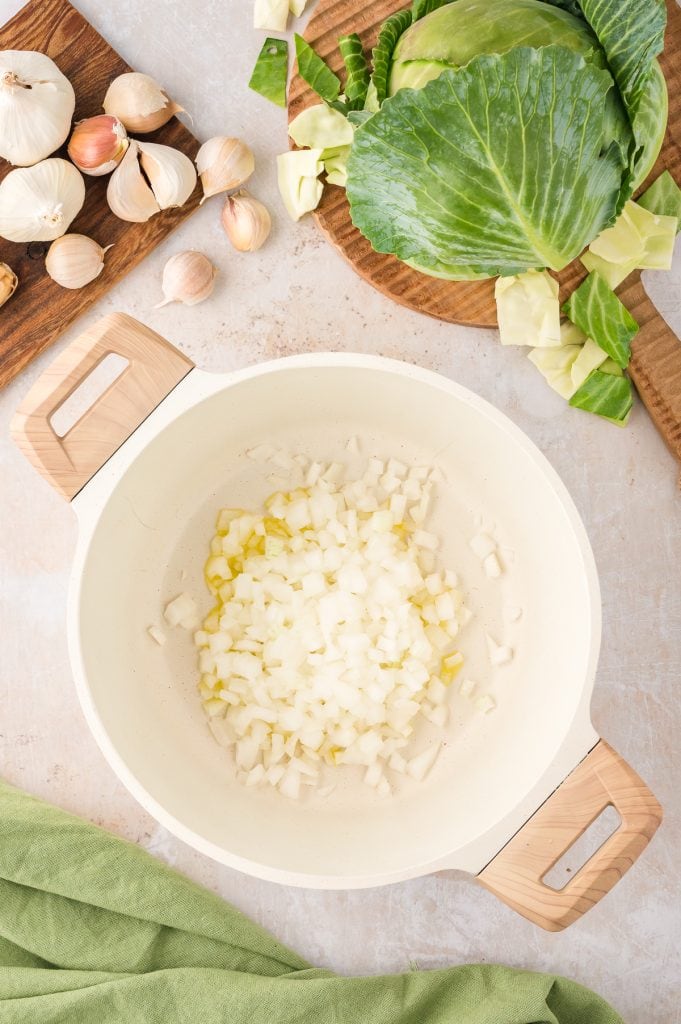 Onions sauteing in a Dutch oven