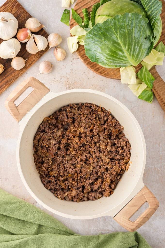 Seasoned ground beef in a Dutch oven