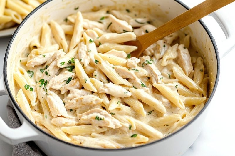 Chicken penne pasta cooked in a pot.