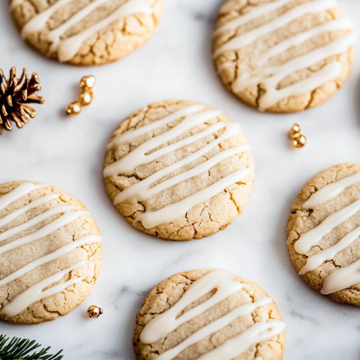 Eggnog snickerdoodles on white marble table with sweet glaze, top view