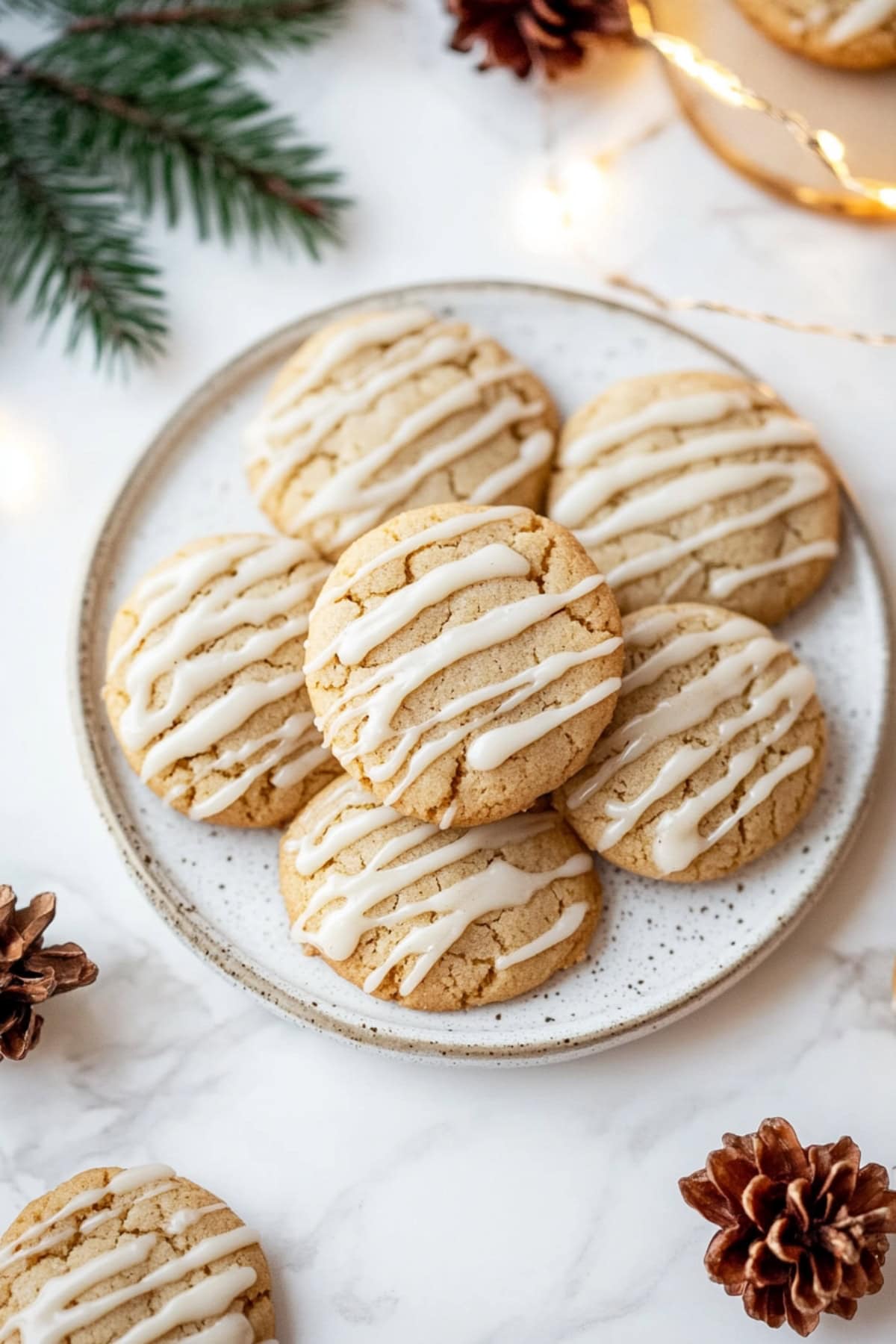 An overhead view of snickerdoodles on a plate with glaze. 