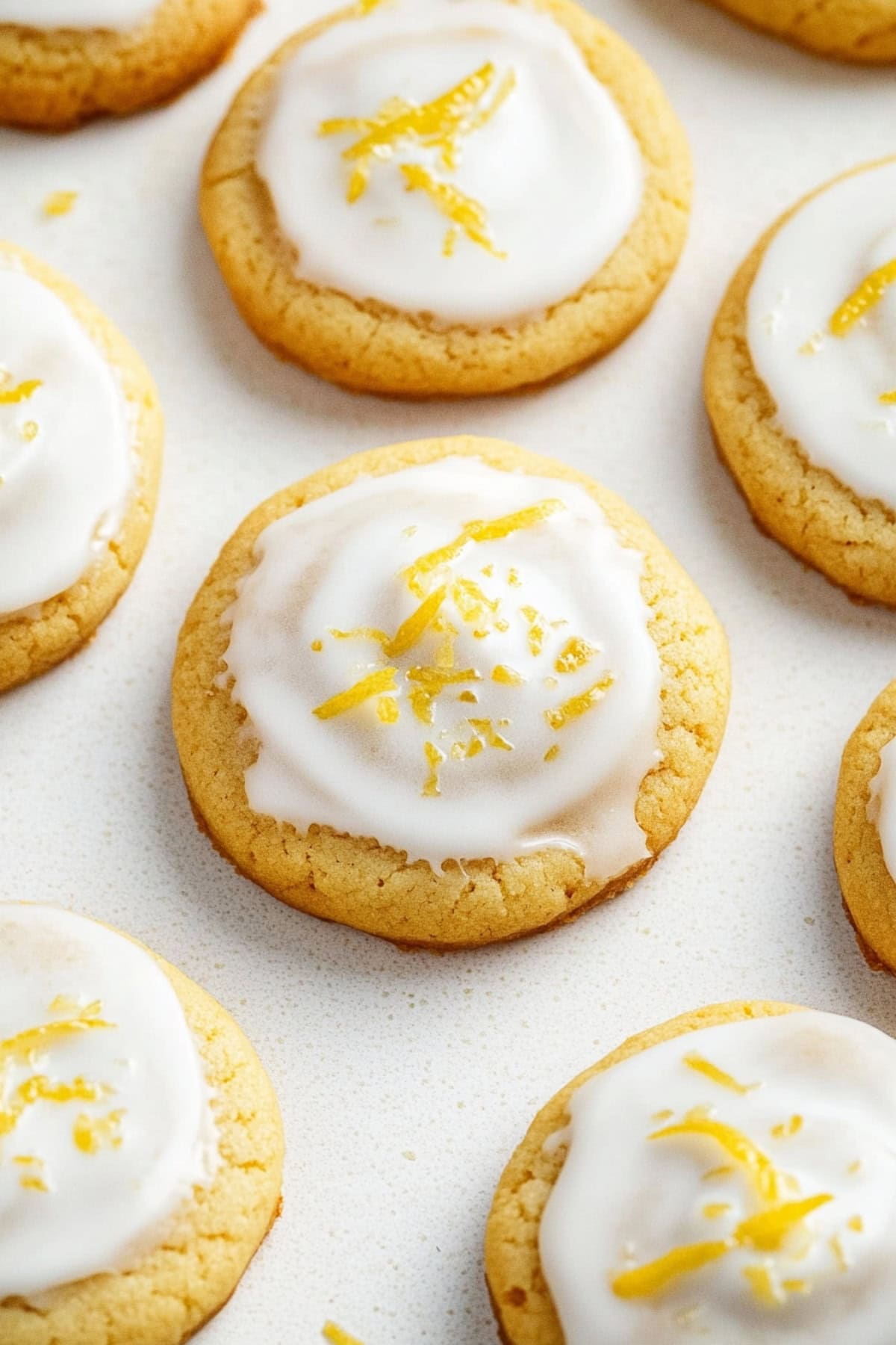 Glazed lemon cookies on a table, top view