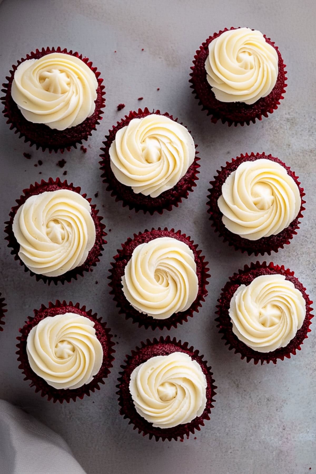 Red velvet cupcake with rich and swirling cream cheese frosting, 