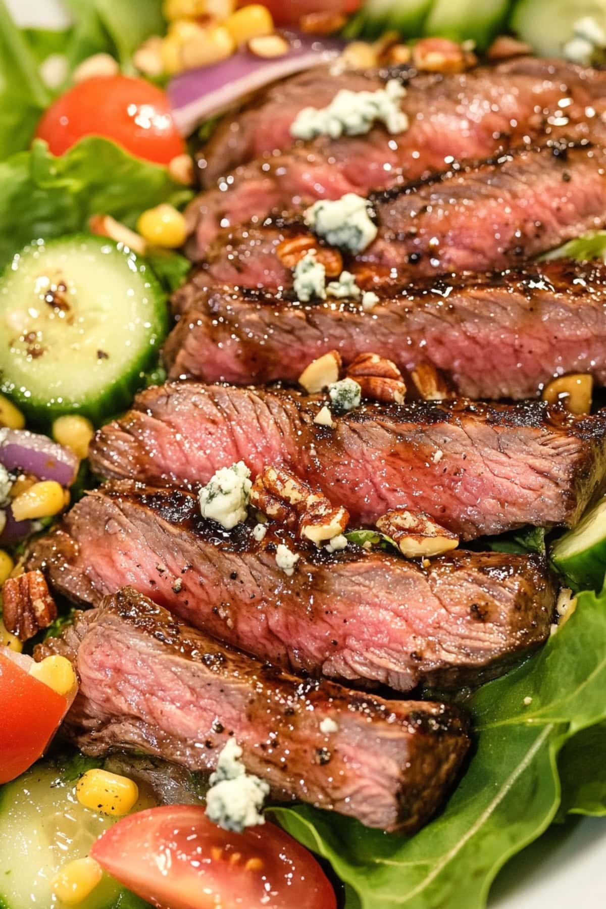 Homemade steak salad with cucumber, onions, corn, blue cheese and chopped nuts.