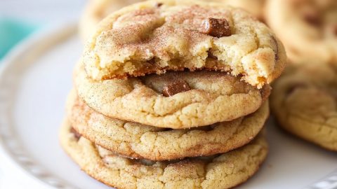 Freshly baked toffee cookies with a crispy edge, soft center, and a scattering of toffee bits on top.