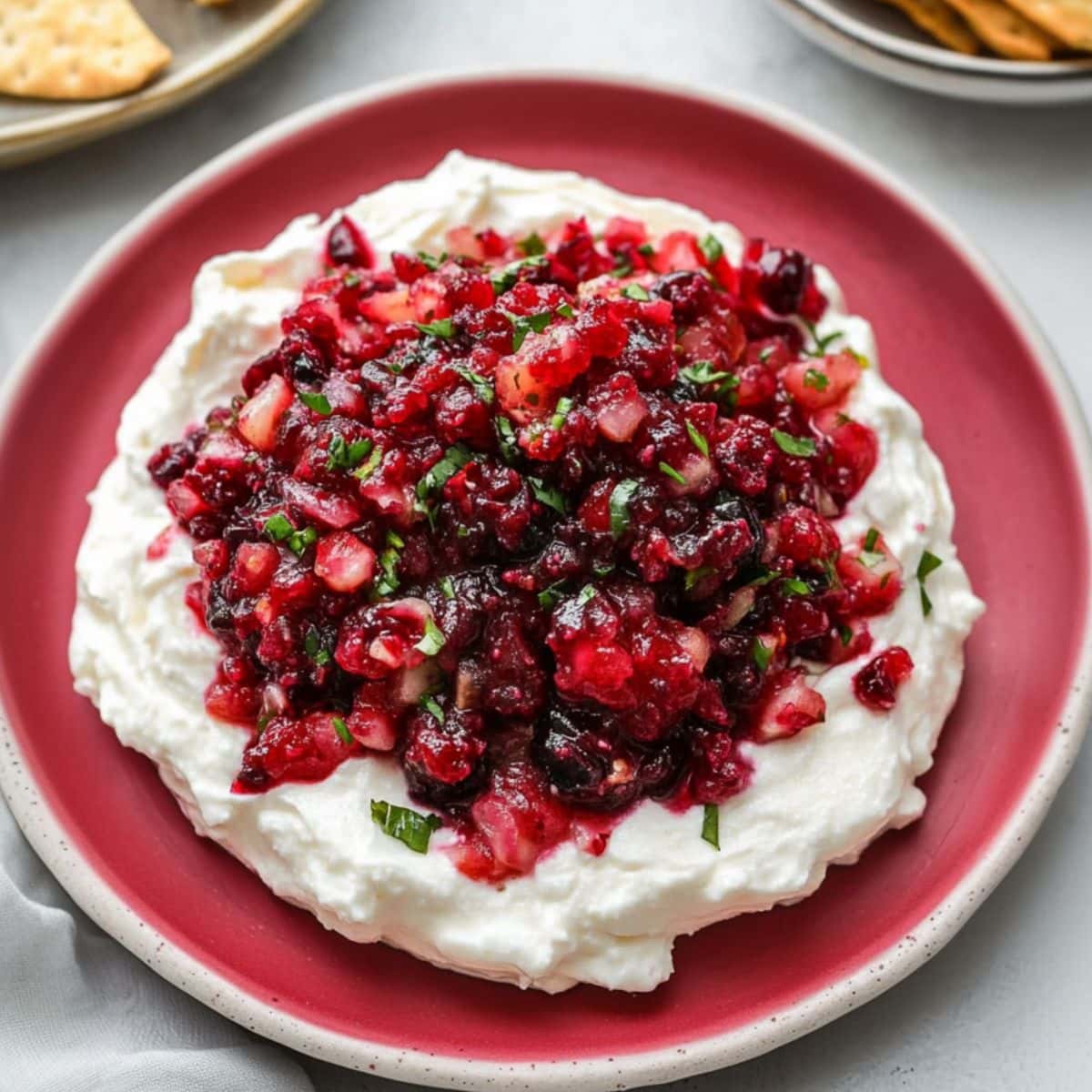 Cranberry and jalapeño salsa served on top of whipped cream cheese, top view