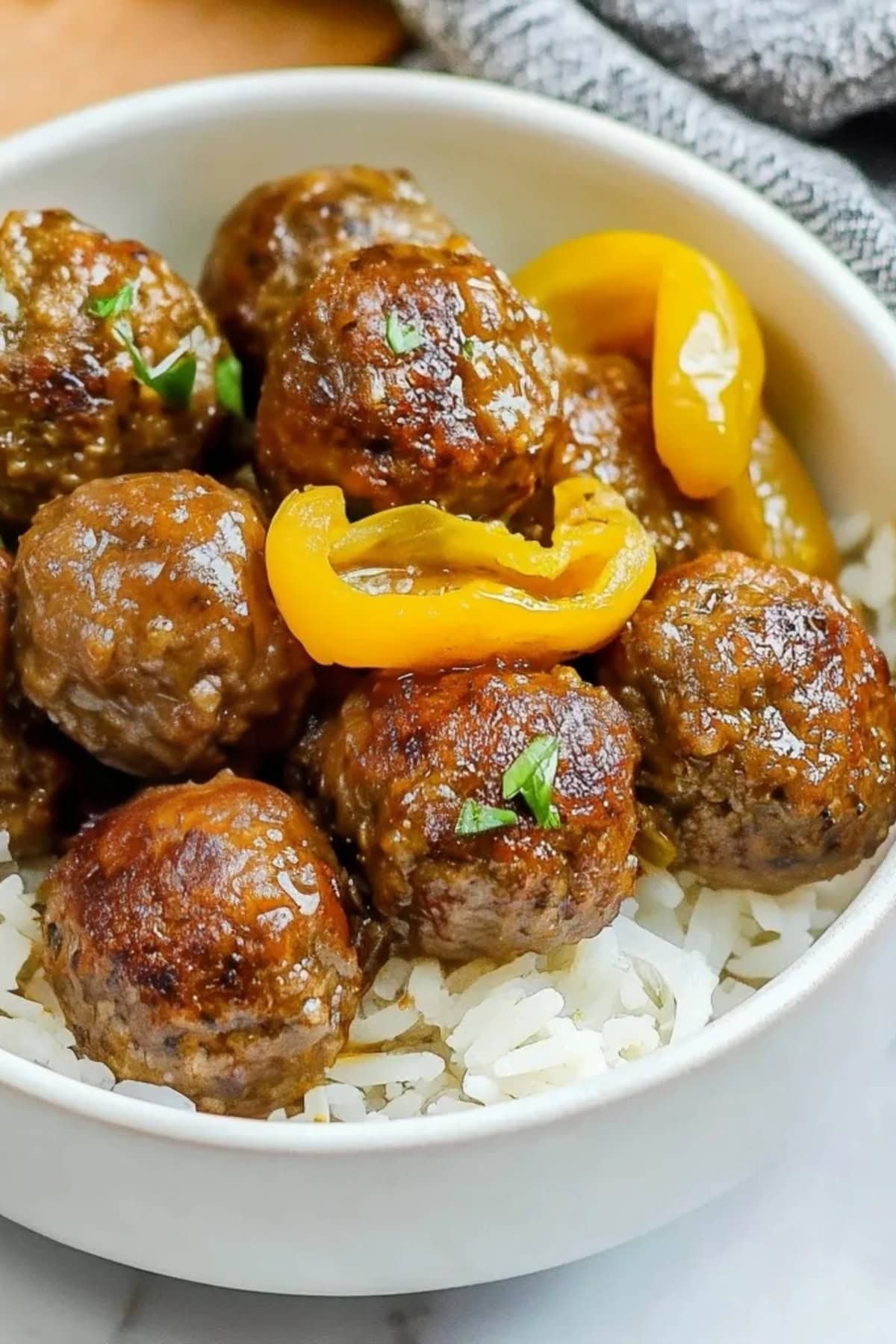 A bowl of crockpot Mississippi meatballs with a hearty and savory sauce.