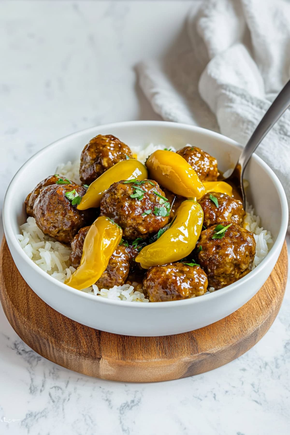 Homemade meatballs with rice and peppers in a bowl.