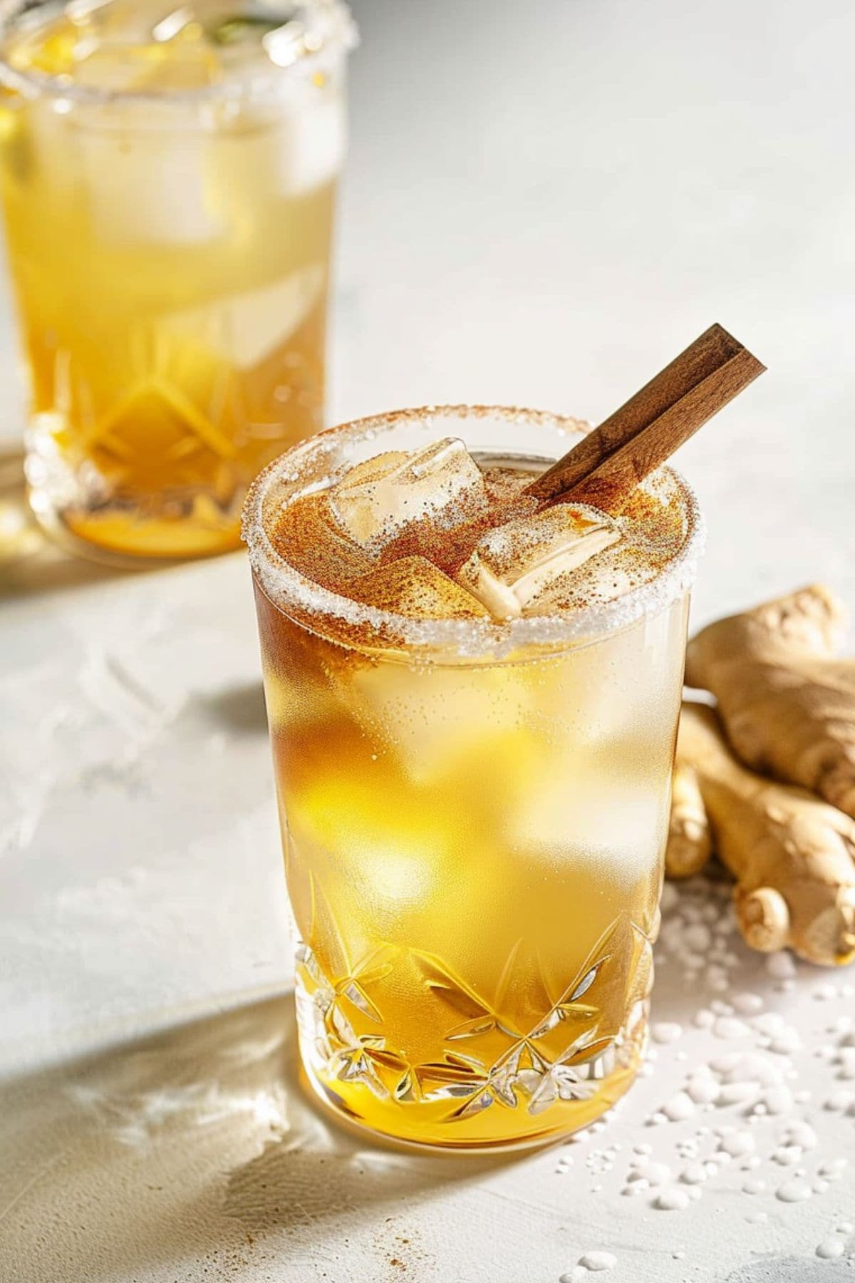 Gingerbread fizz mocktail served with cinnamon sticks and ice.