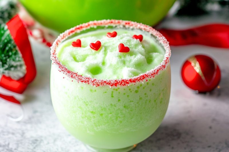 Grinch inspired punch drinks in a punch glass.