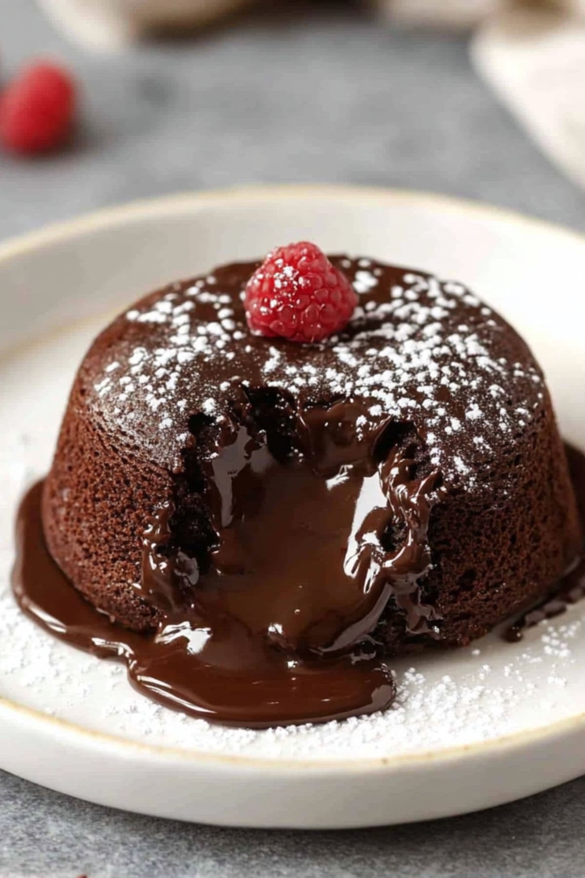 Lava cake with melted chocolate filling on a plate