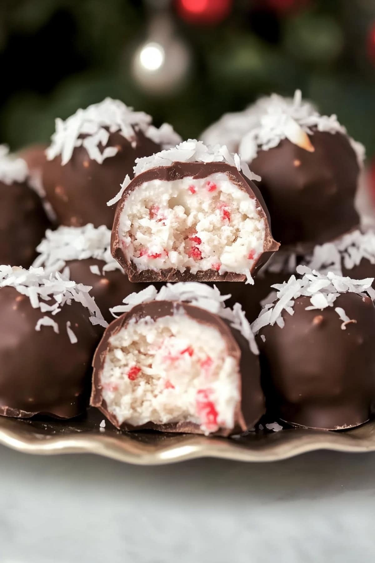 A close-up of a cut Martha Washington candy, revealing its soft, coconut-filled center.