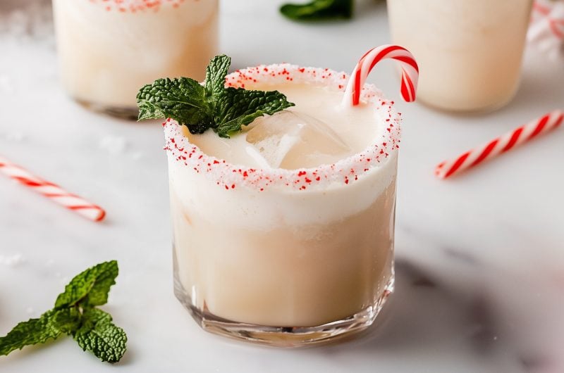 Creamy homemade white Russian drink with peppermint and mint in a glass.