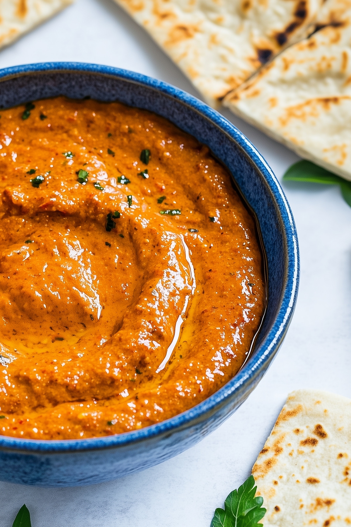 Roasted red pepper dip served with pita bread.