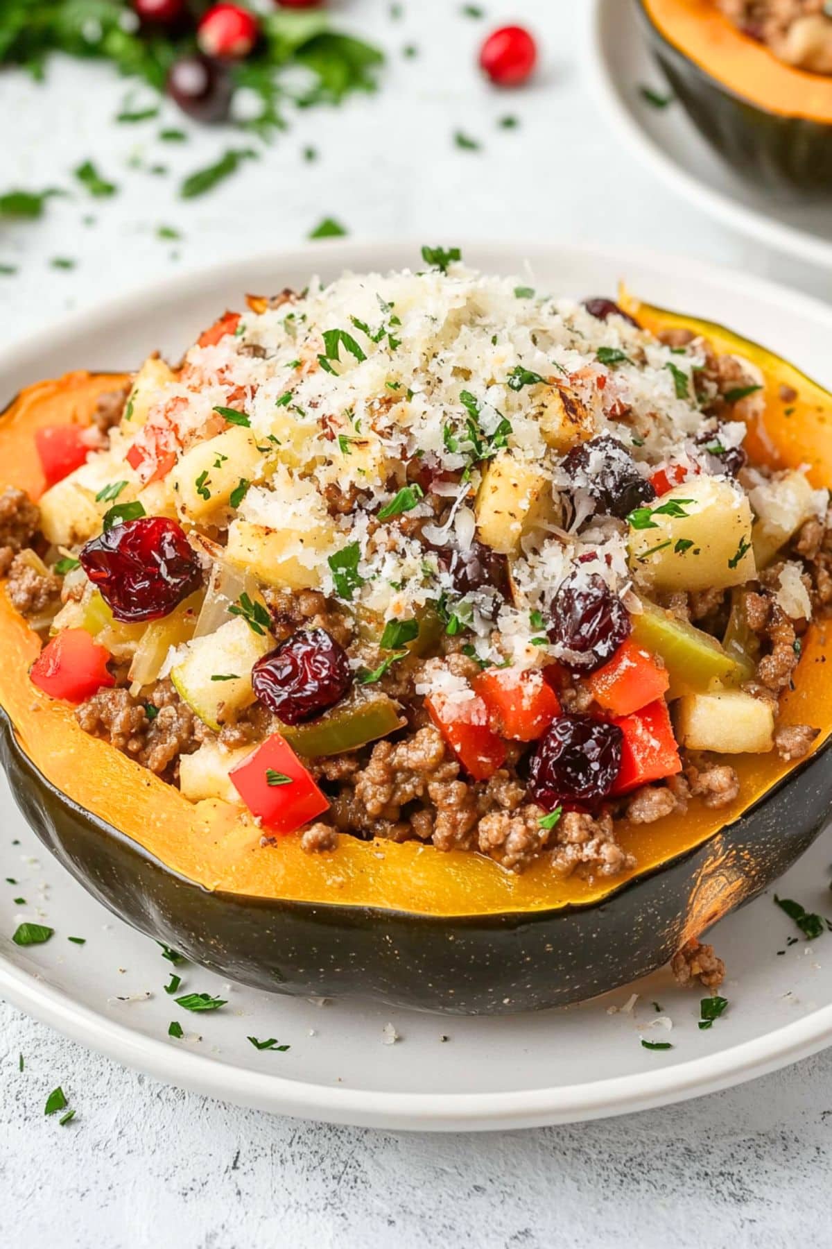 Sauteed sausage with chopped apples, red bell pepper, cilantro, cranberries and nuts filled inside roasted acorn squash.