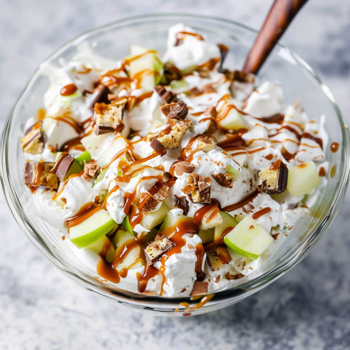 Creamy Snickers salad in a glass bowl