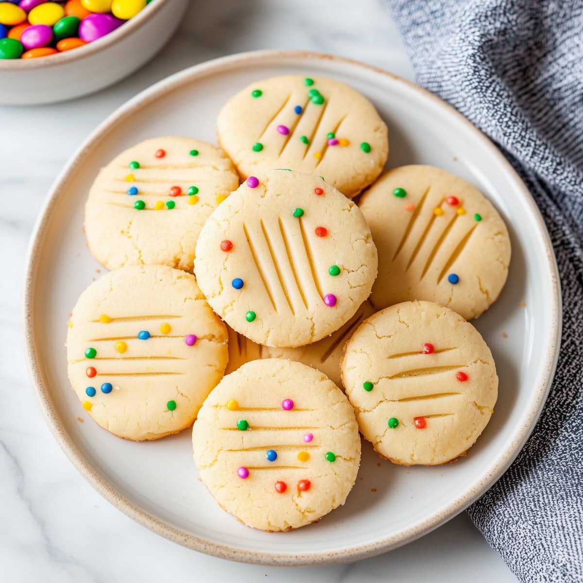 A plate of homemade soft and buttery whipped shortbread cookies.