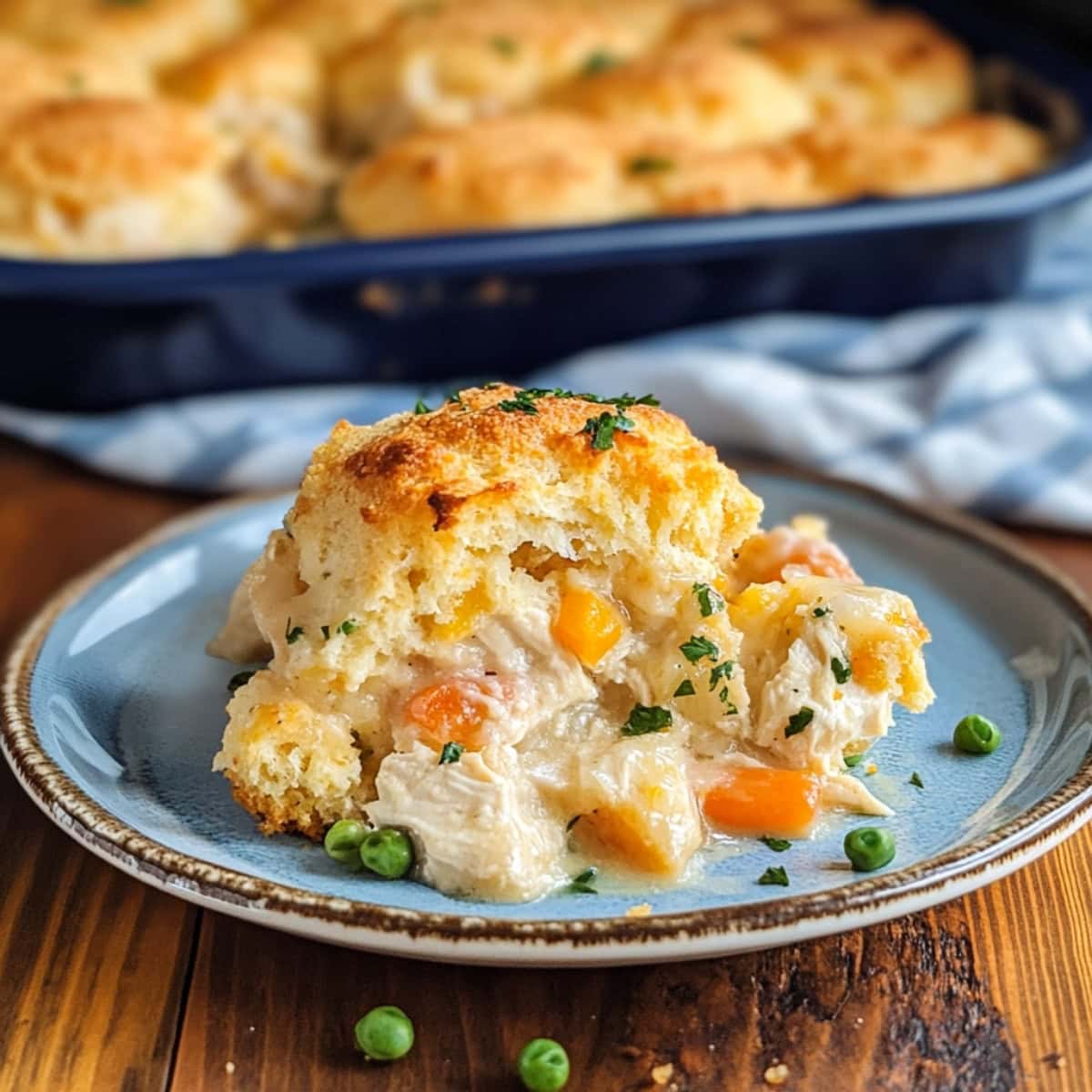 Serving of cheddar bay biscuit chicken served in a white plate. 