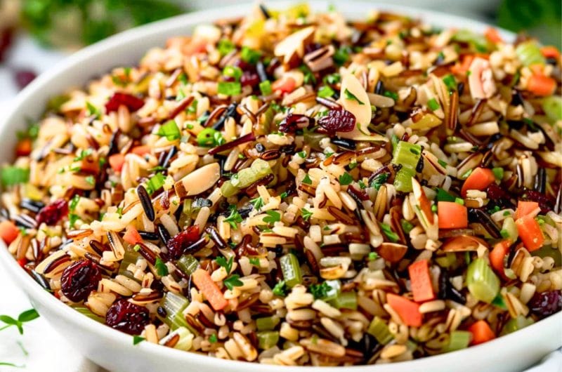 Wild rice pilaf serving in a white bowl.