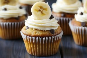 Homemade banana cupcakes with chocolate chips and cream cheese frosting.