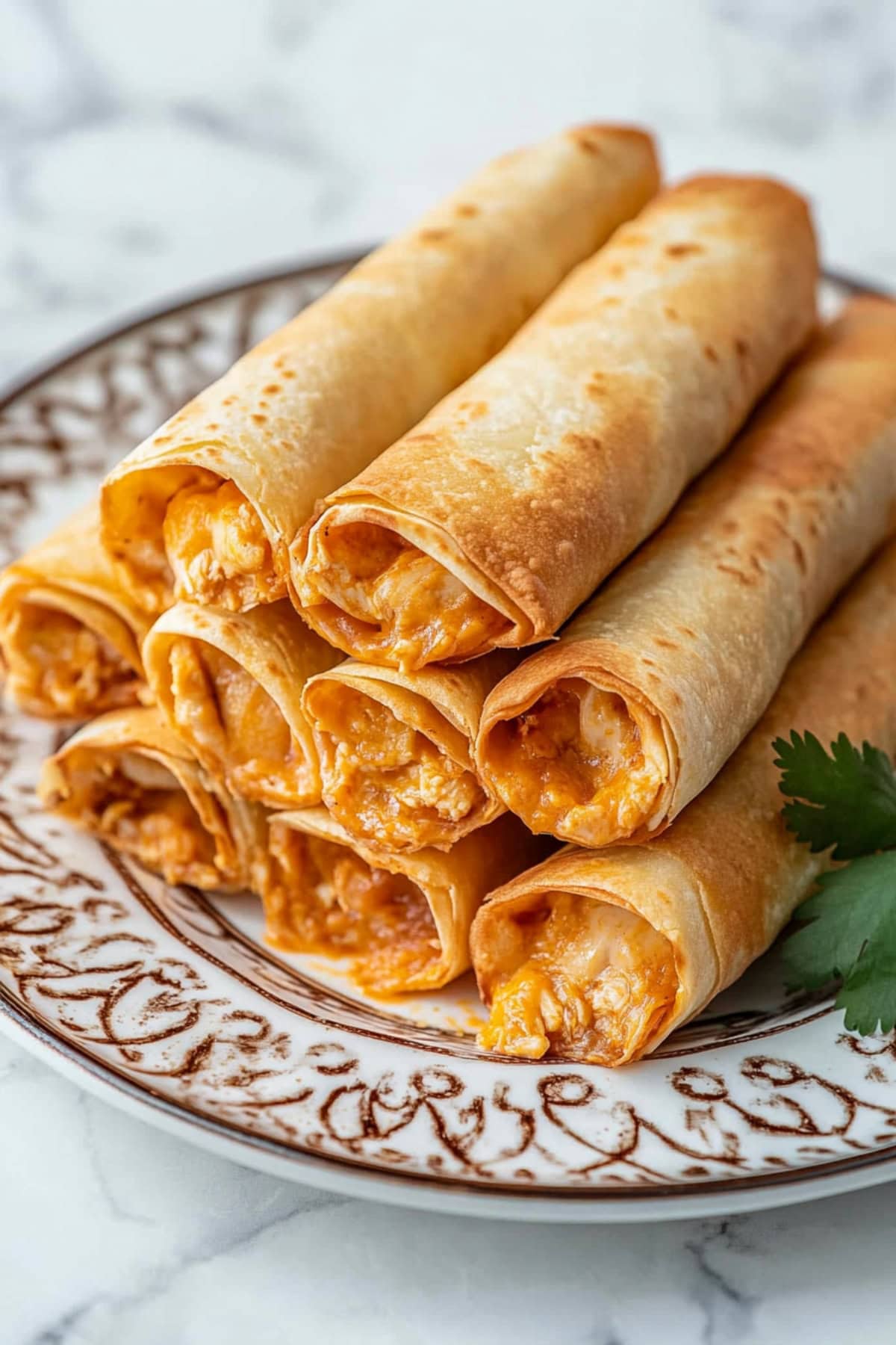 Crispy and cheesy chicken taquitos in  an elegant plate.