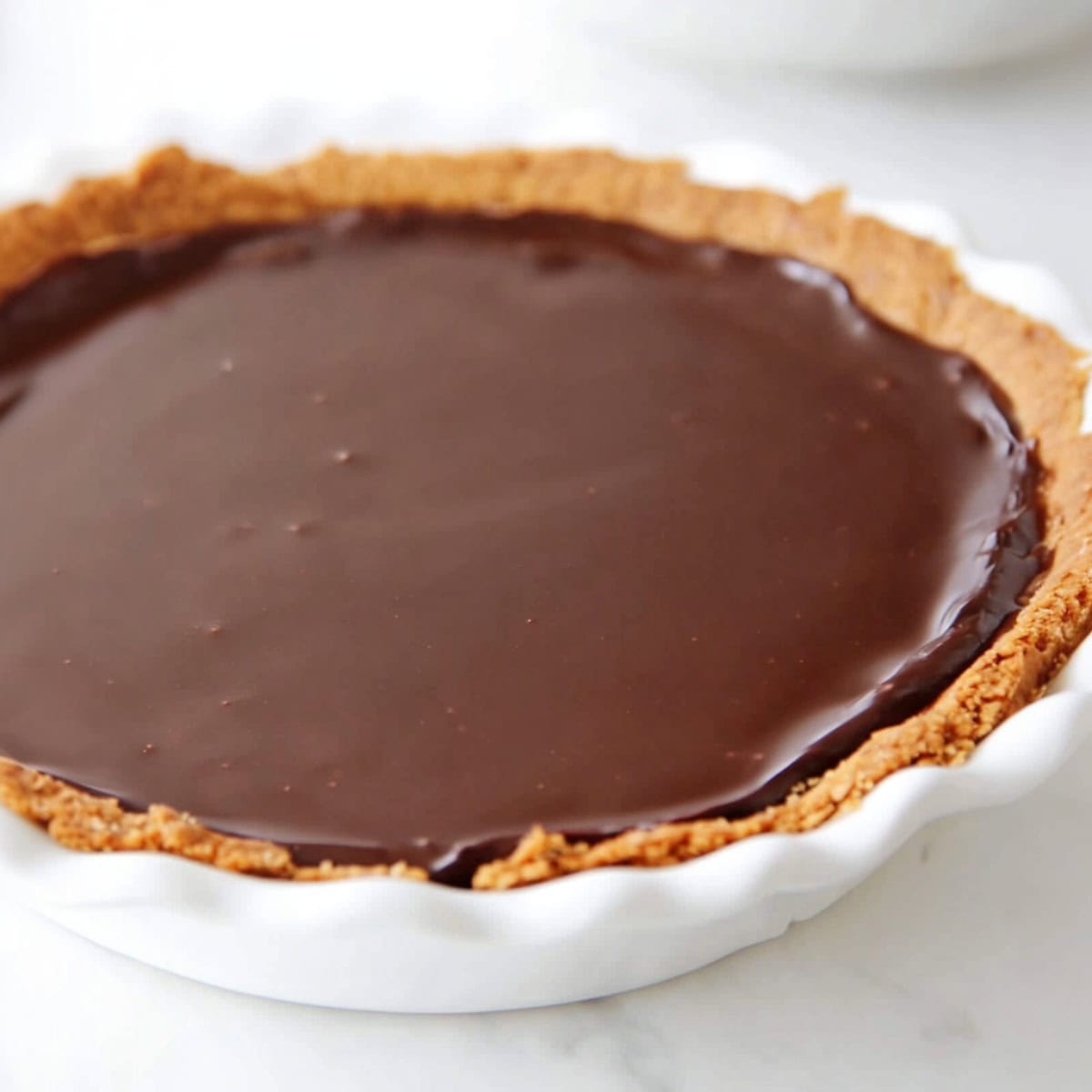 Chocolate pudding pie in a pie dish.