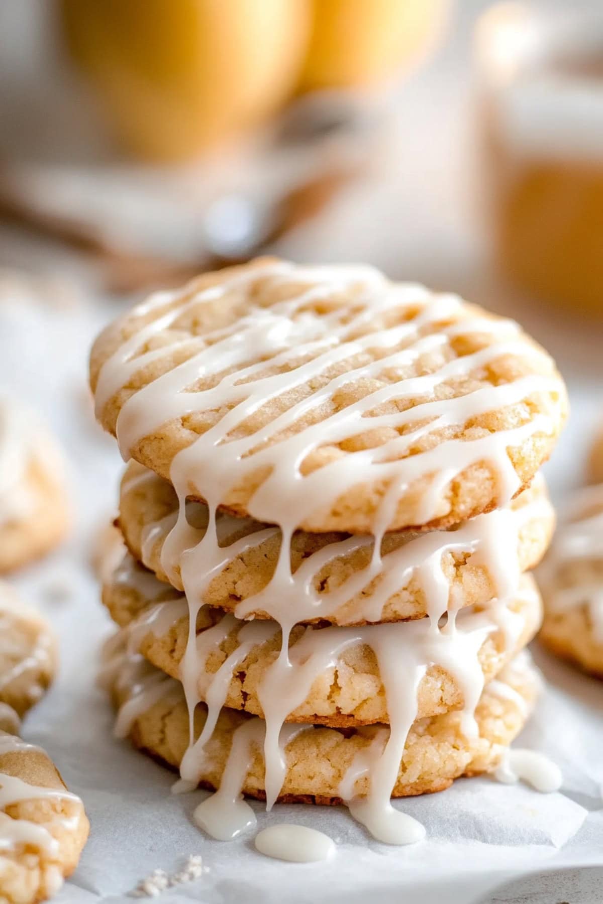 A stack of freshly baked apple cider cookies, with a light glaze of cinnamon sugar sprinkled on top.