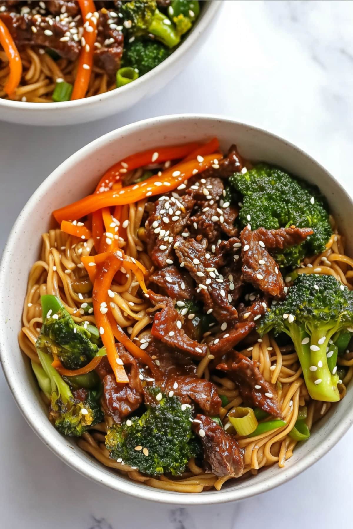 A hearty portion of beef and broccoli lo mein with perfectly cooked noodles, slices of beef, and broccoli, all tossed together in a savory sauce.