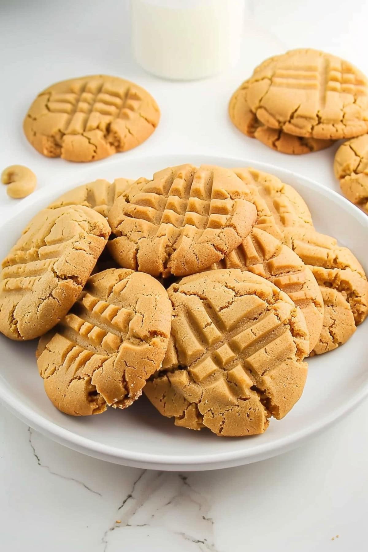 Cake mix peanut butter cookies on a white plate.