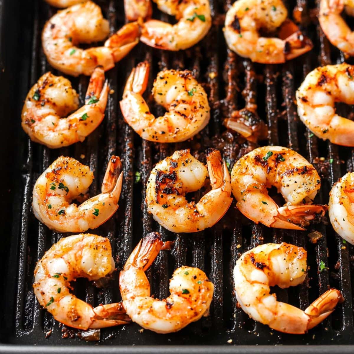 Seasoned shrimp in grill pan.