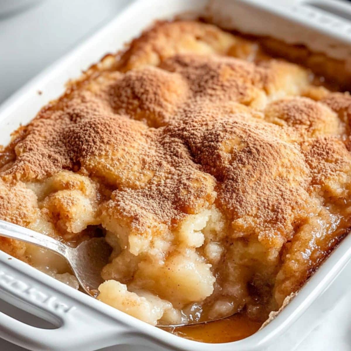 White baking dish with snickerdoodle cobbler.