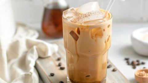 Iced coffee in a glass filled with ice.