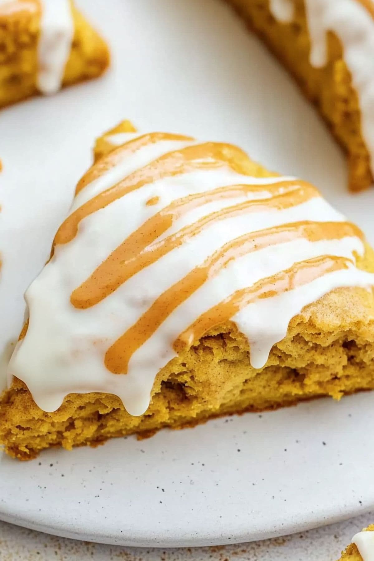 Copycat Starbucks pumpkin scones with sweet glaze, close up