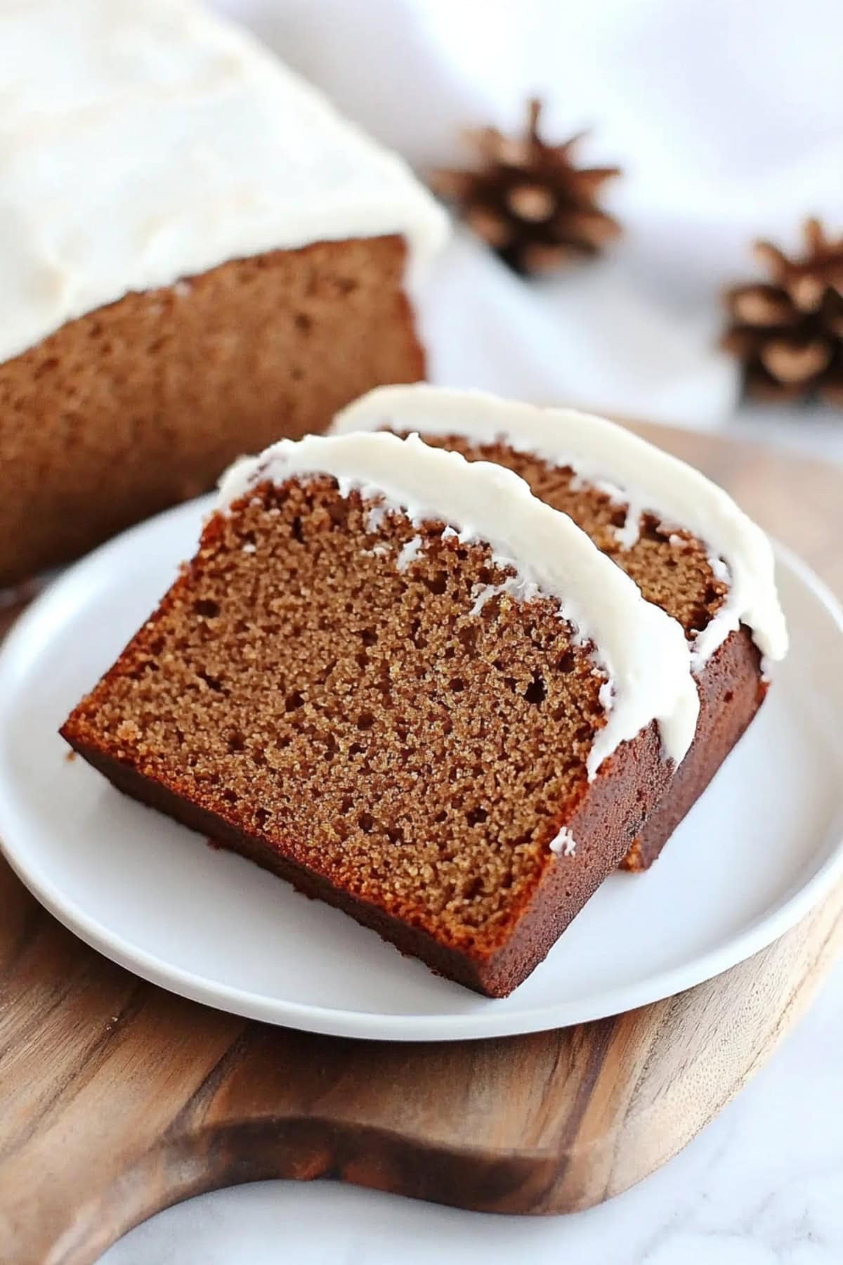 Sliced and whole gingerbread load with cream frosting. 