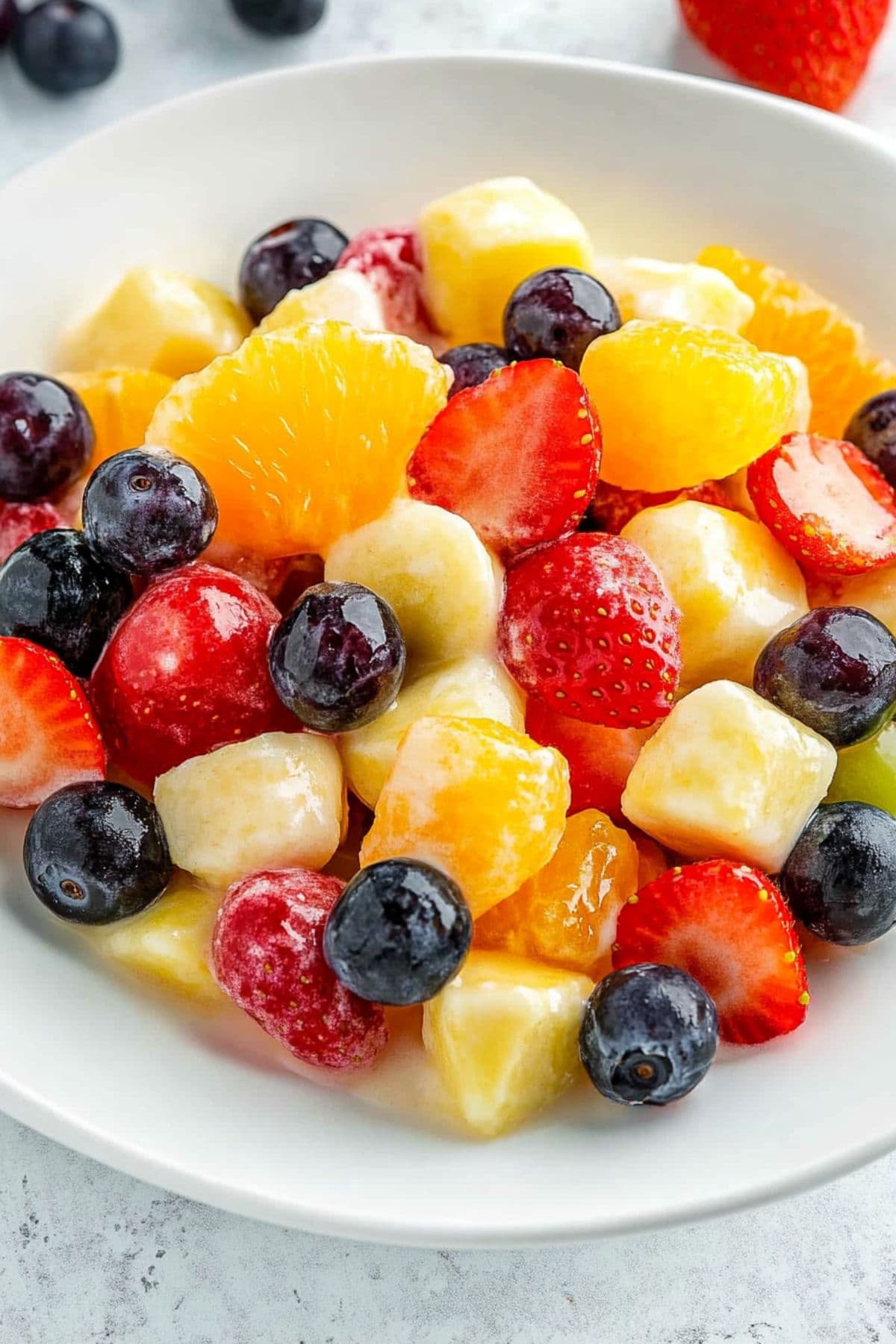 Pineapple chunks, mandarin oranges, bananas, strawberries, blueberries, and grapes tossed in vanilla padding mix.