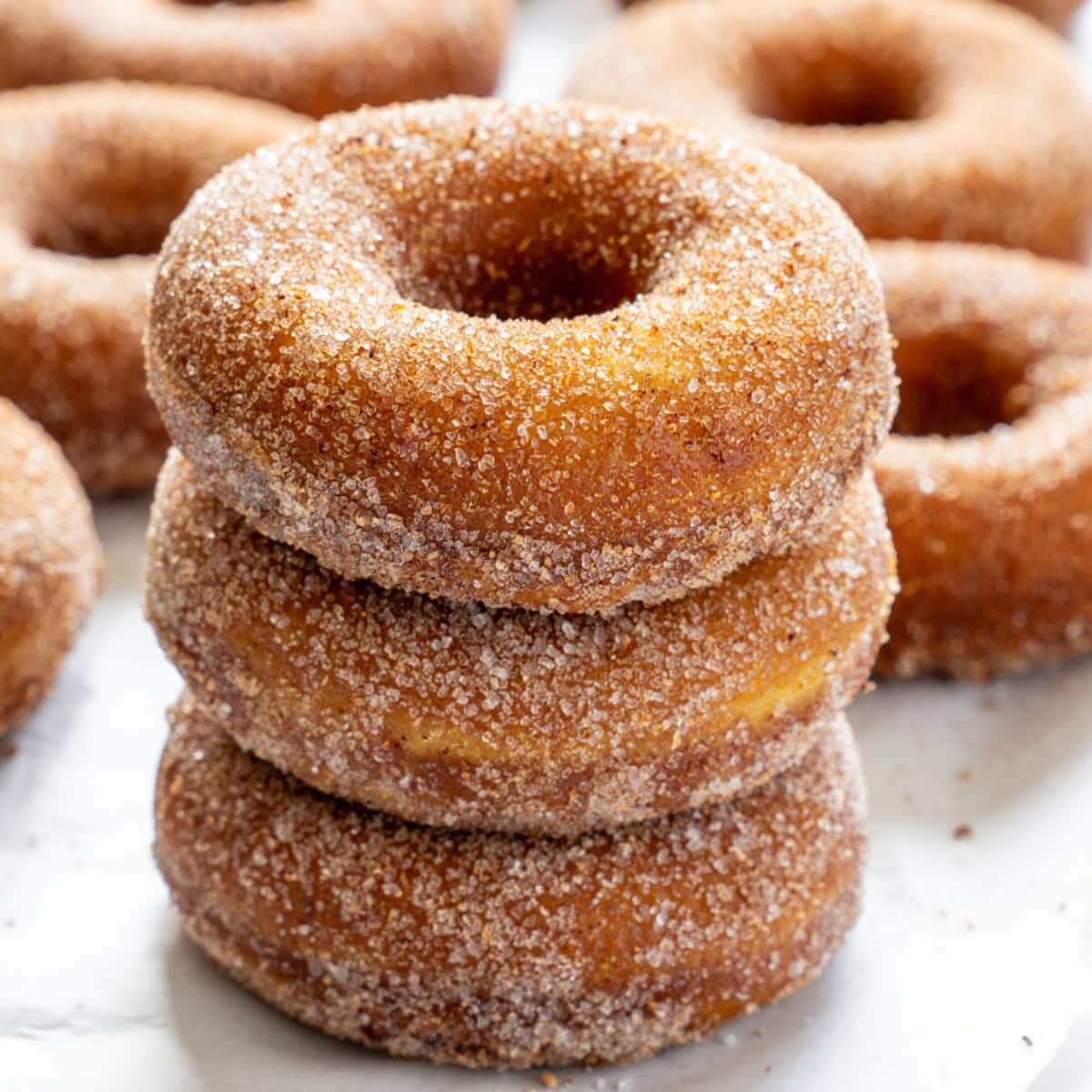 Canned biscuit donuts coated in cinnamon sugar.